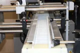 Harland Sirius Pressure-Sensitive Labeling Machine with Conveyor System