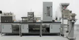 Landry Engineering Filling Station with TechnaVibes Feeders for Syringes